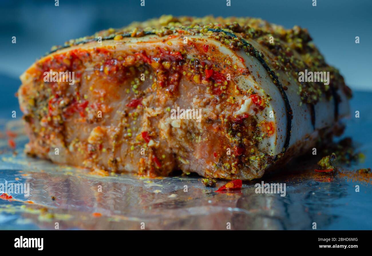 Boneless British rindon pork loin joint, prepared in marinades