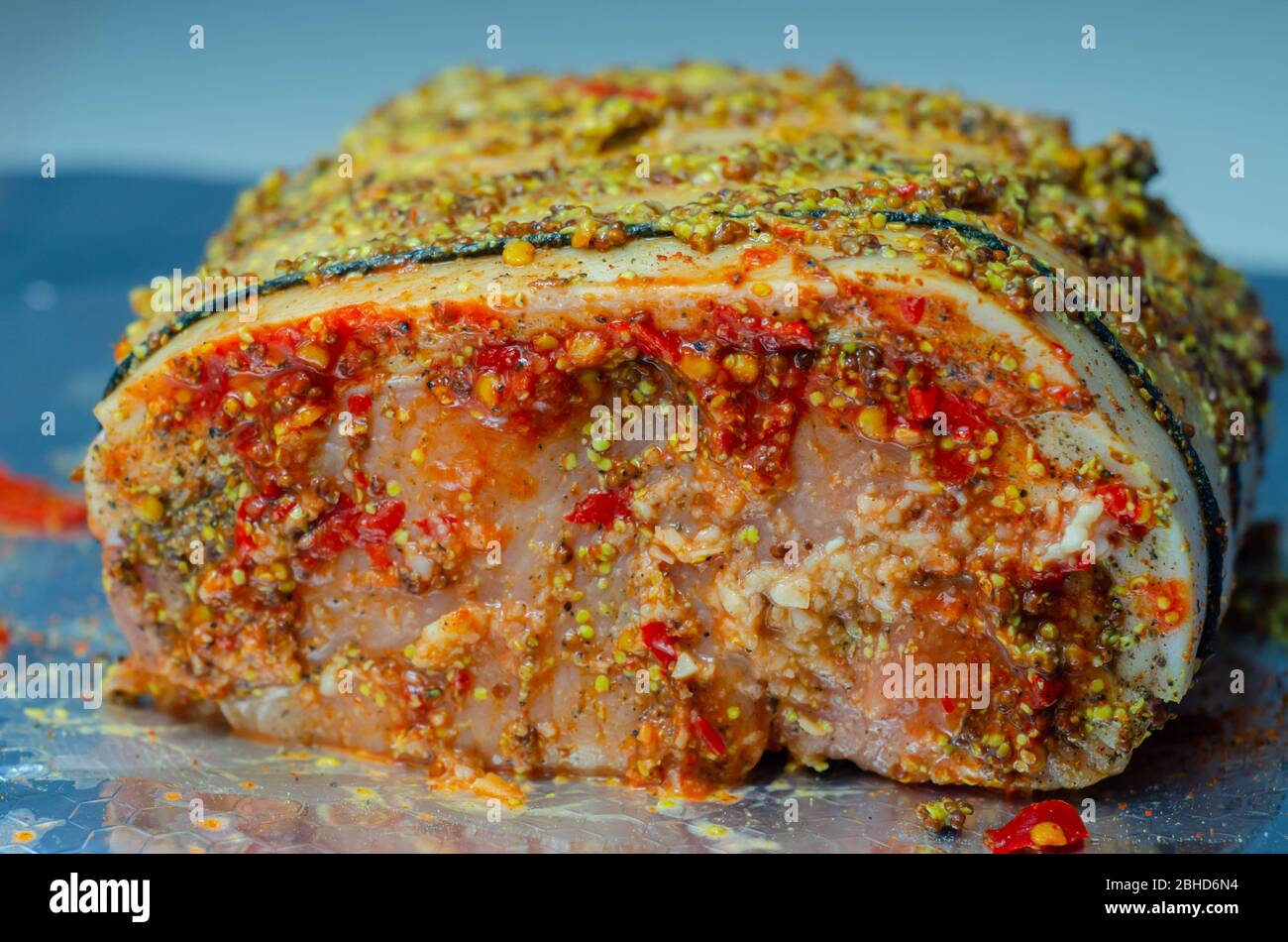 Boneless British rindon pork loin joint, prepared in marinades
