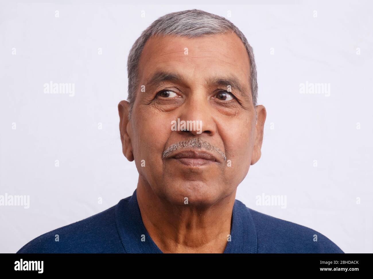 Close-up portrait of happy senior man isolated on white background Stock Photo