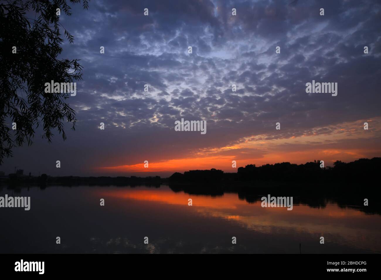 waterside sunset - very beautiful scenery Stock Photo - Alamy