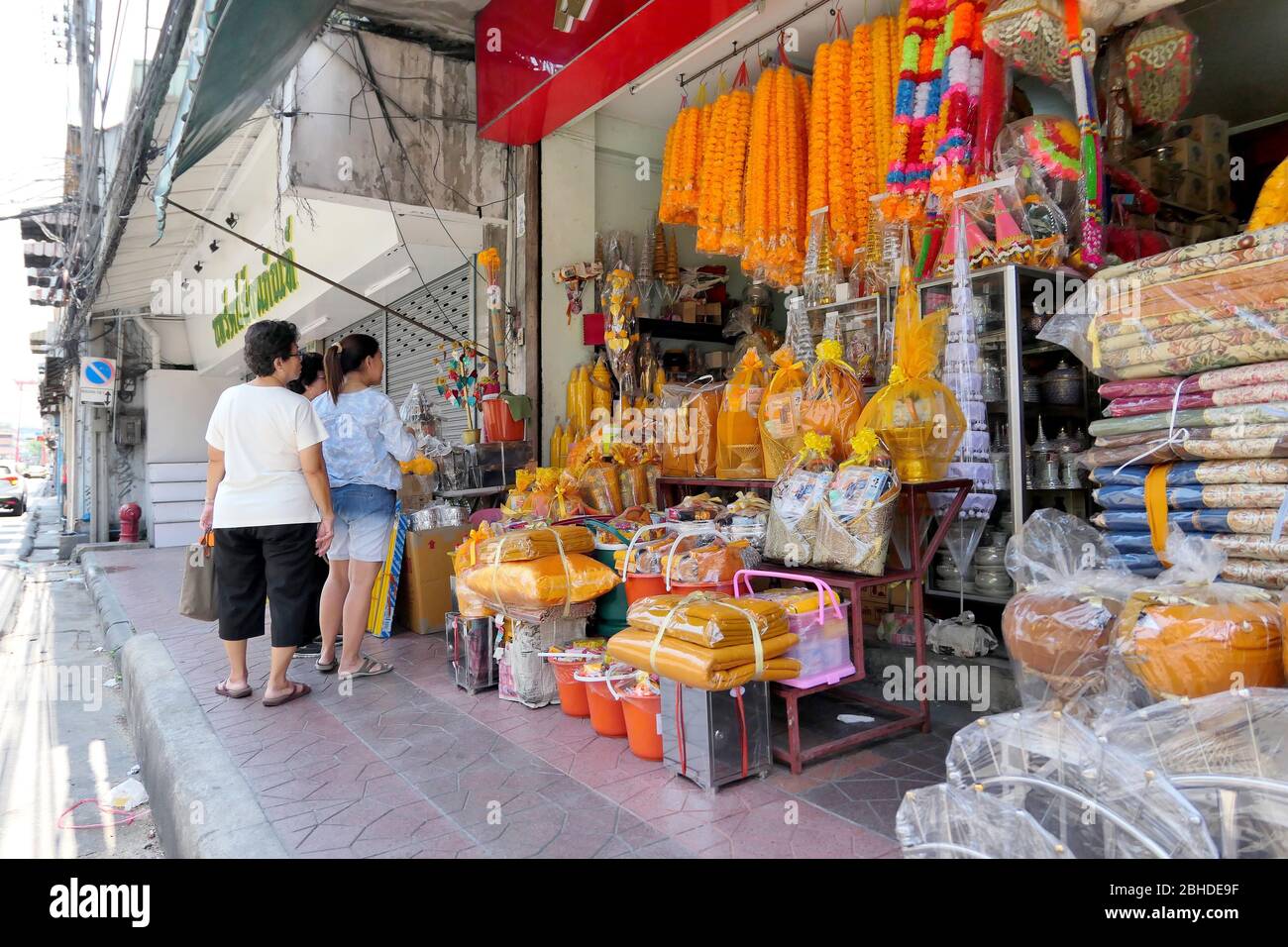 The Thai people are choosing religious goods for making merrit at the religious shop beside the main road of Bangkok, Thailand April 14, 2018 Stock Photo