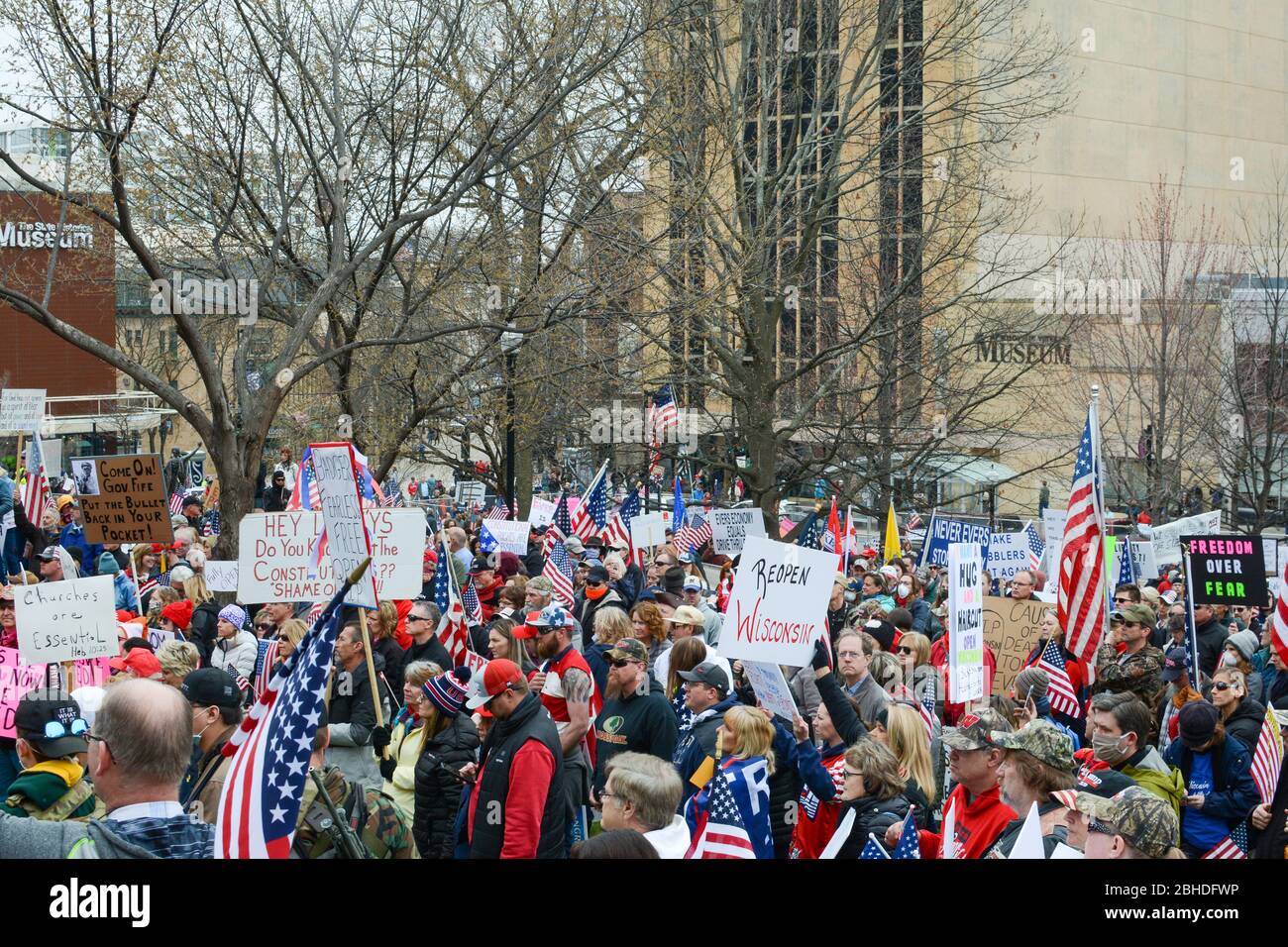 Demonstrators in the Capitol city of Madison, WI. Protesting the extended stay at home order the Governor handed down. Stock Photo