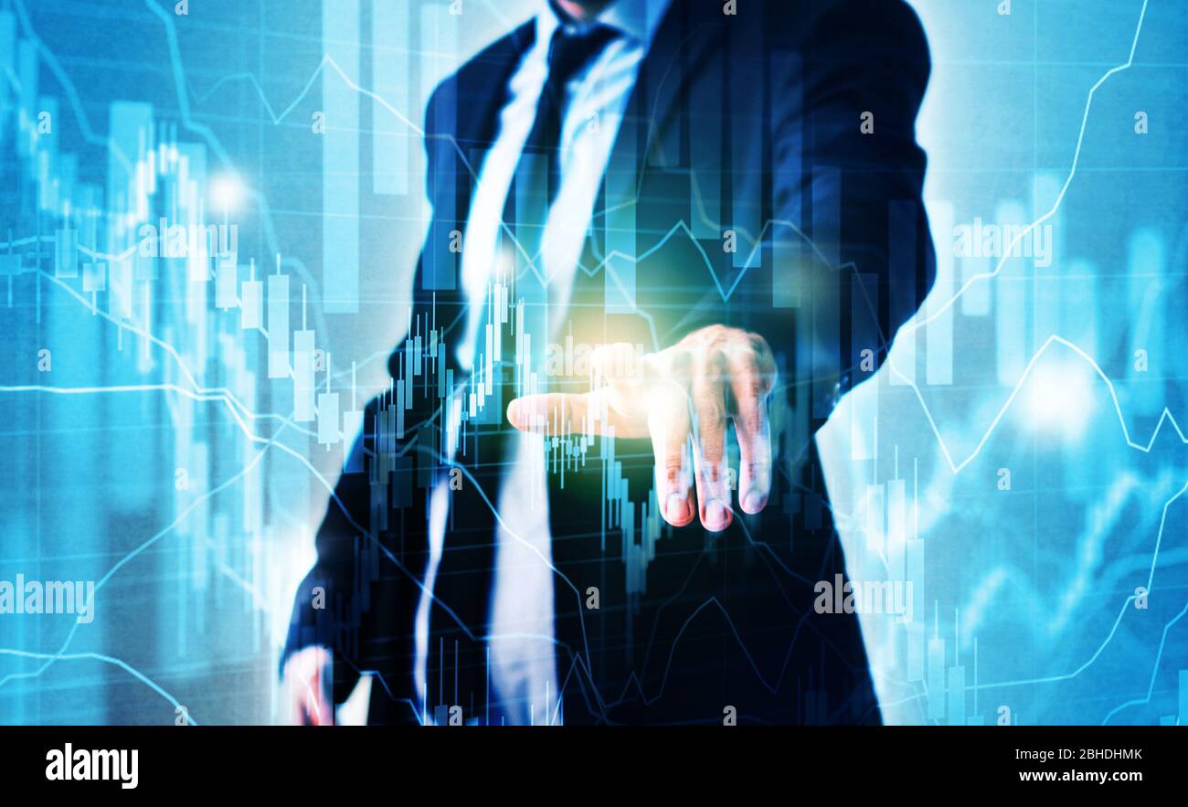 businessman pointing on virtual stock market chart - trading concept Stock Photo
