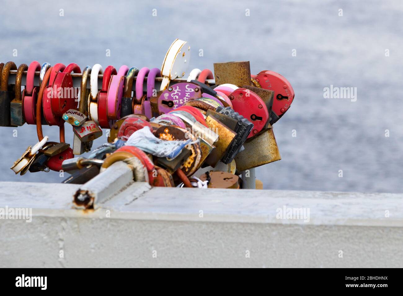 Padlocks hanging on the railing of the bridge Stock Photo Alamy