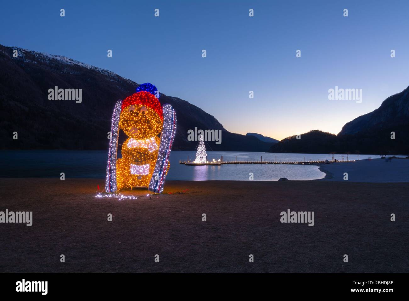Molveno Lake and the Molveno village in Trentino Alto Adige - Trento, norther Italy. Night landscape of the Molveno lake during the Christmas holiday Stock Photo
