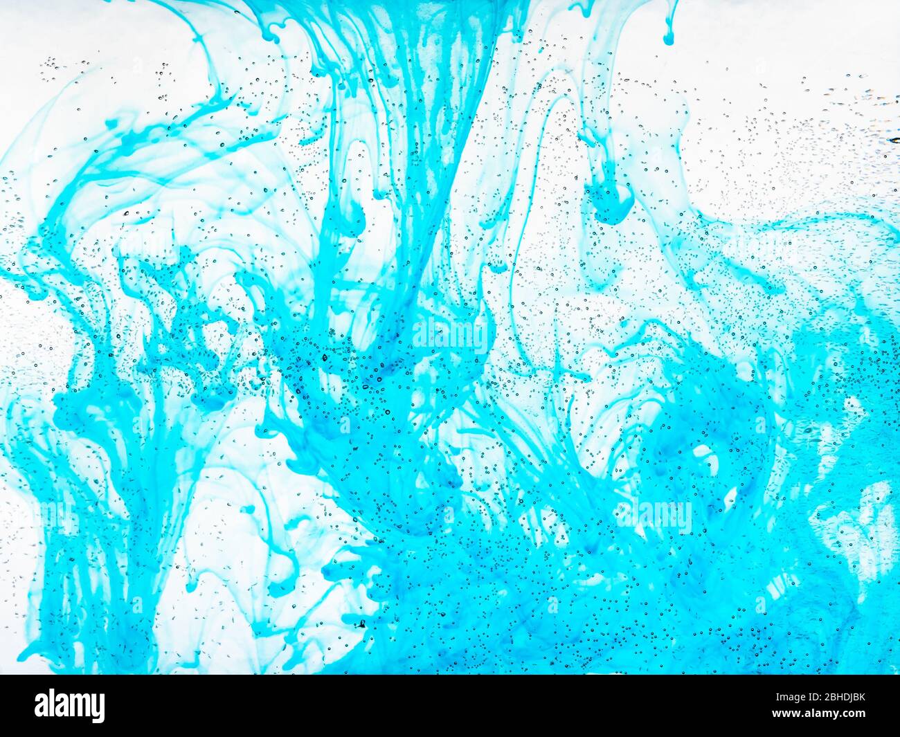 air bubbles on glass surface of flat bottle and aquamarine ink