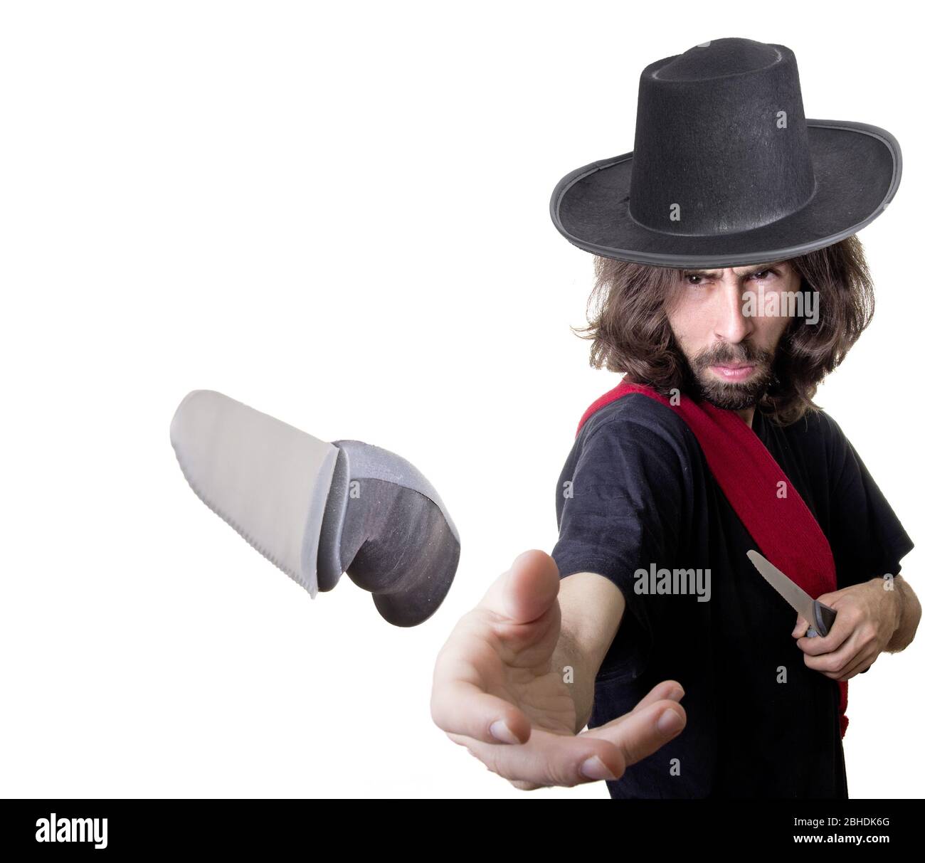 a knife thrower with long hair Stock Photo