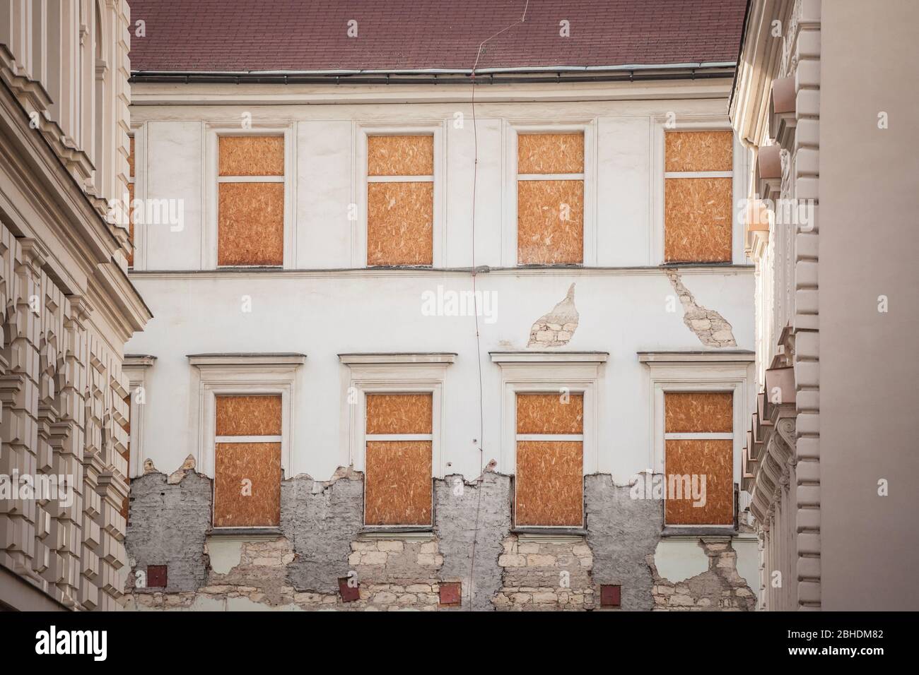 Condemned & boarded windows on a baroque Facade of old appartment ...