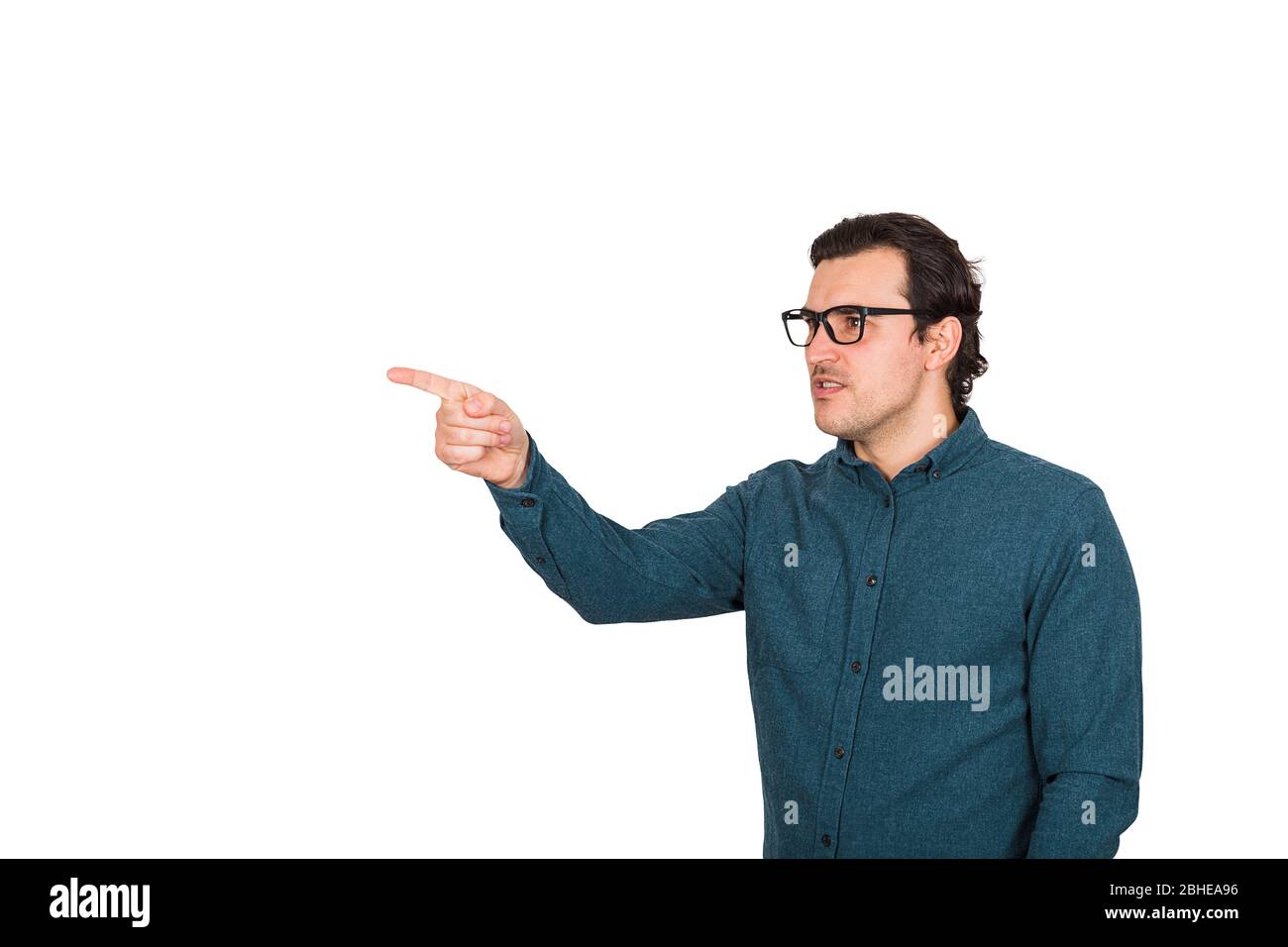 Furious businessman pointing forefinger blaming someone as guilty, or scolding isolated on white background with copy space. Serious annoyed emotion b Stock Photo
