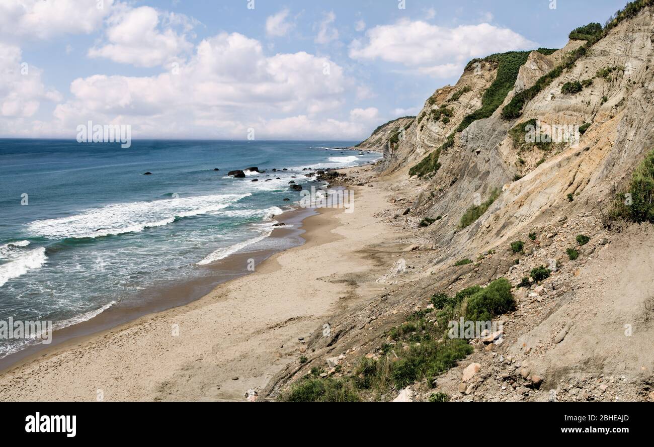 Cliffside Beach in Rhode Island Ocean waves break on a sandy beach