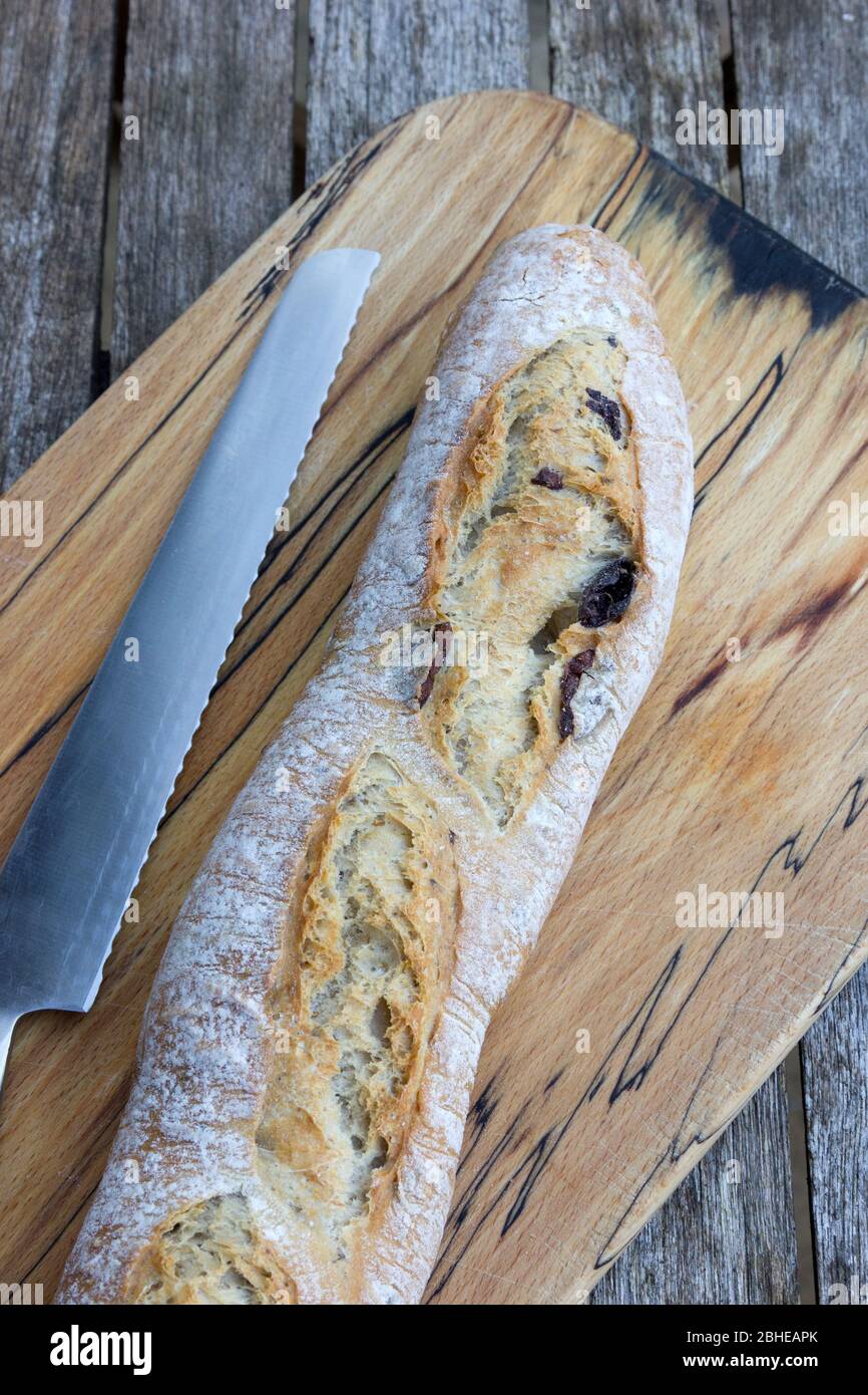 https://c8.alamy.com/comp/2BHEAPK/olive-bread-on-a-wooden-board-2BHEAPK.jpg