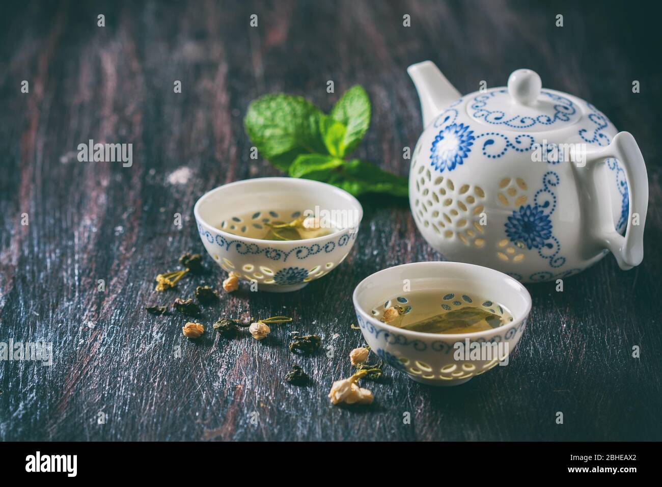 Chinese tea set, green tea and fresh mint. Selective focus Stock Photo ...