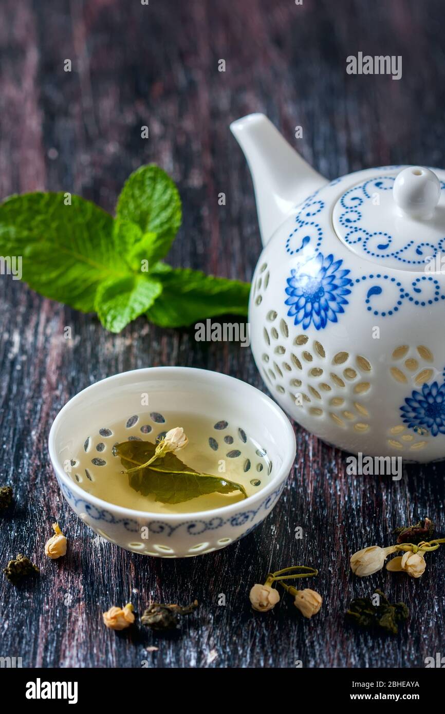 Chinese tea set, green tea and fresh mint. Selective focus Stock Photo ...
