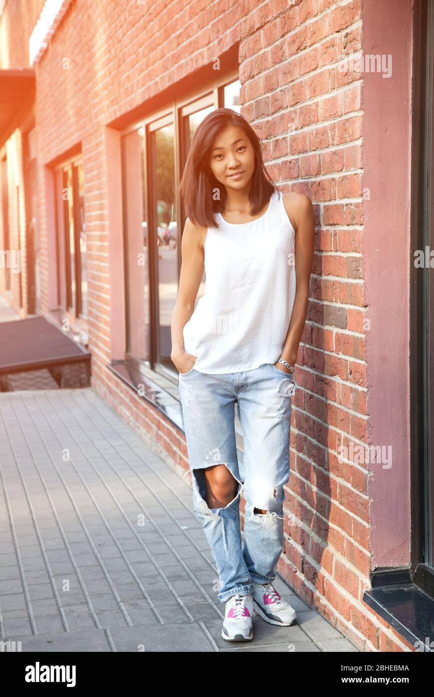 Young chinese girl in jeans hi-res stock photography and images - Alamy