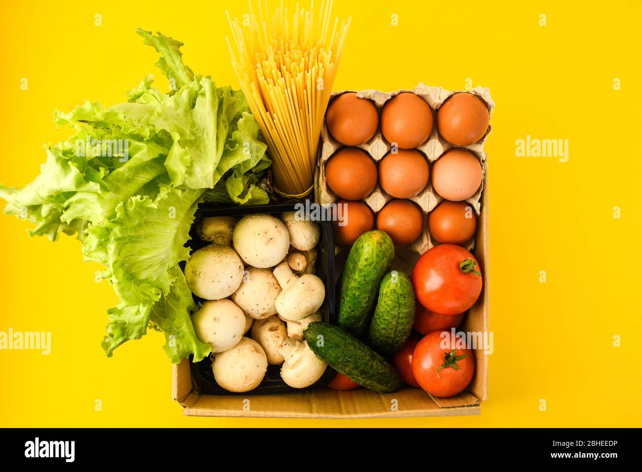 Download Groceries In Paper Box Basket With Fresh Vegetables And Fruits On Yellow Background Stock Photo Alamy PSD Mockup Templates