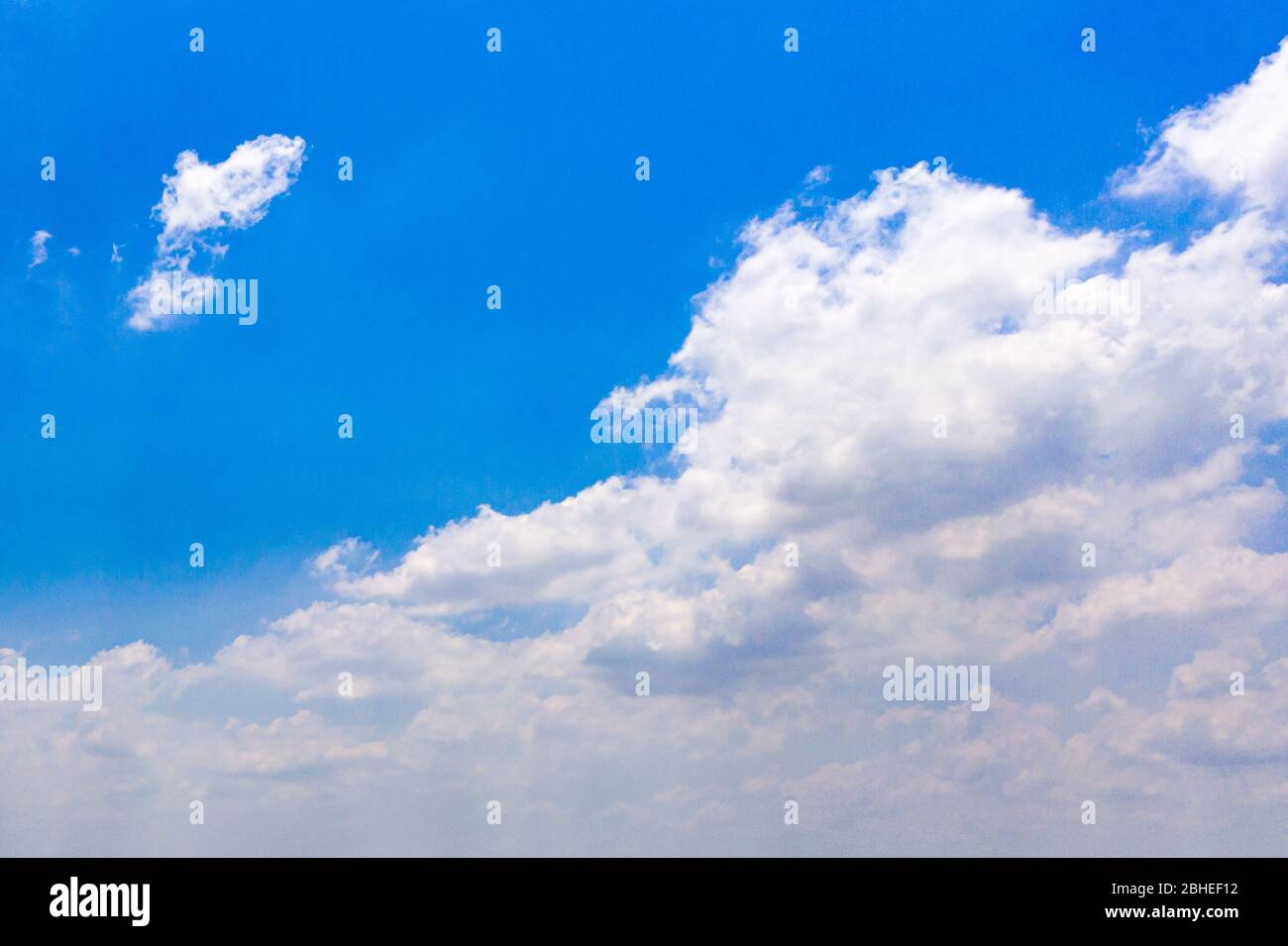 Blue sky background and cumulus white clouds Stock Photo - Alamy