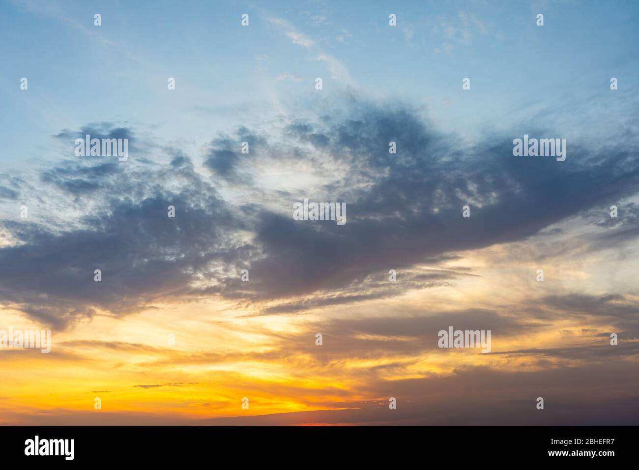 Nature background of clouds on blue sky and orange sunset Stock Photo ...
