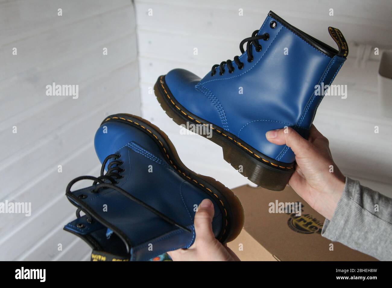 Oslonino, Poland 25th, April 2020 Woman looks at her new pair of Dr. Martens  1460 Air Wair blue leather boots in Oslonino, Poland on 25 April 2020 ©  Vadim Pacajev / Alamy Live News Stock Photo - Alamy