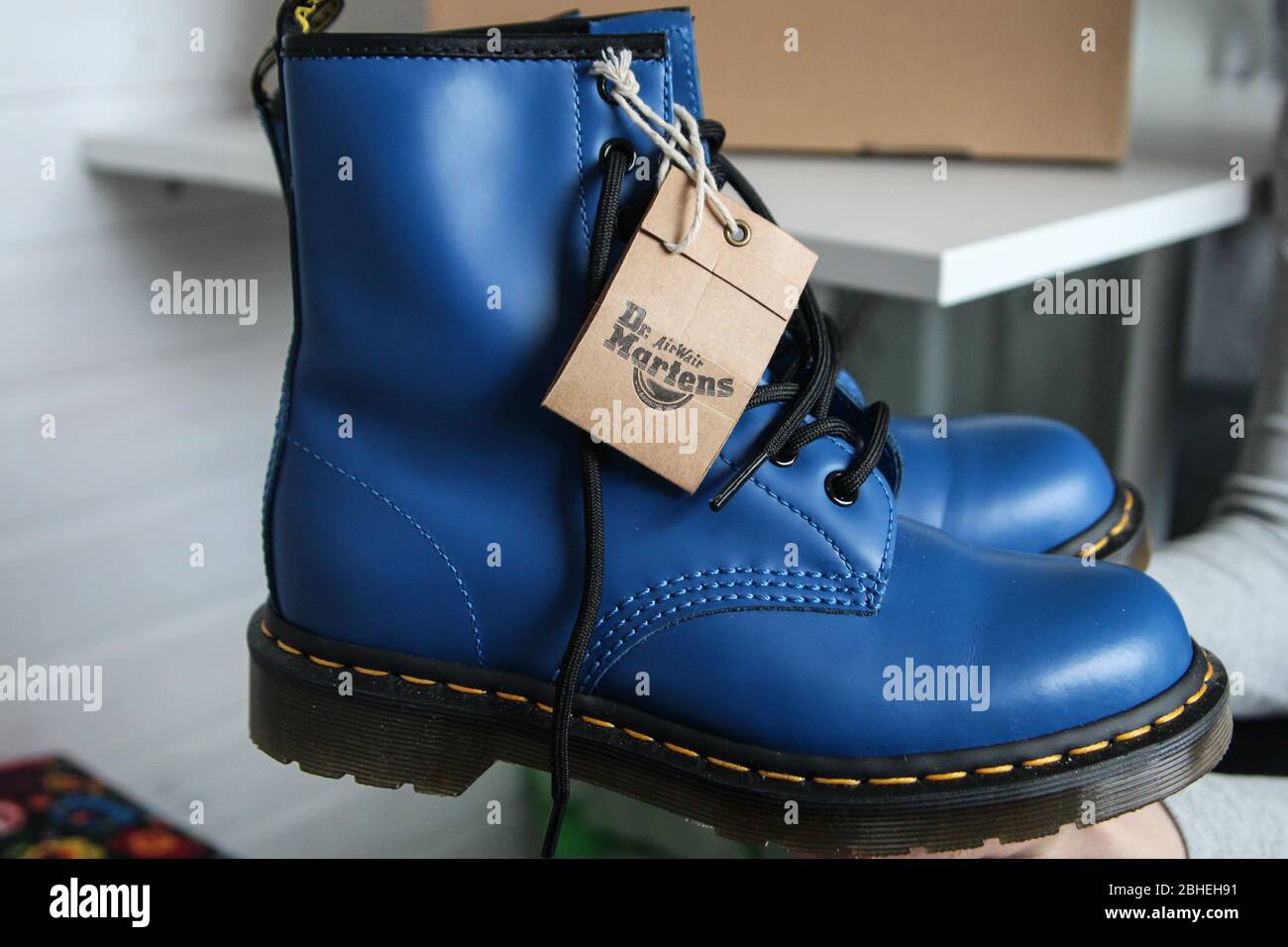 Oslonino, Poland 25th, April 2020 Woman looks at her new pair of Dr. Martens  1460 Air Wair blue leather boots in Oslonino, Poland on 25 April 2020 ©  Vadim Pacajev / Alamy Live News Stock Photo - Alamy