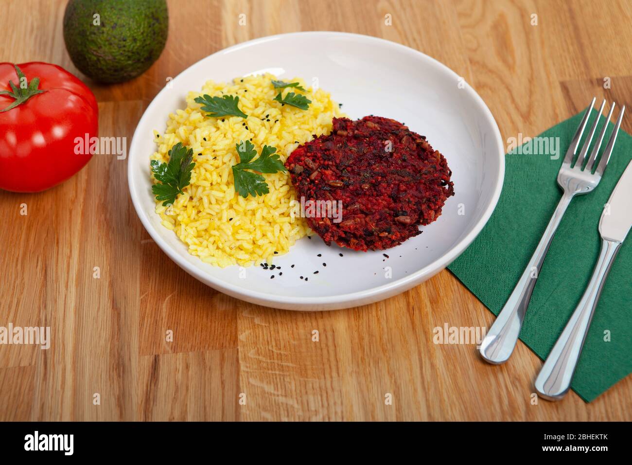 A light lunch without meat. The vegetable burger with rice and parsley. Stock Photo