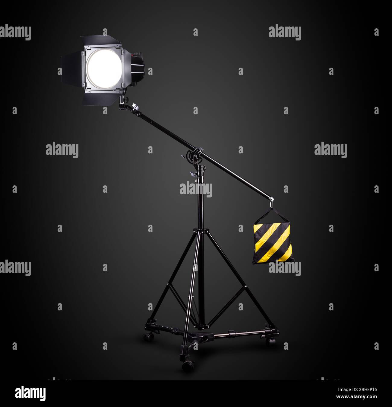 Photography studio flash on a lighting stand isolated on black background Stock Photo Alamy