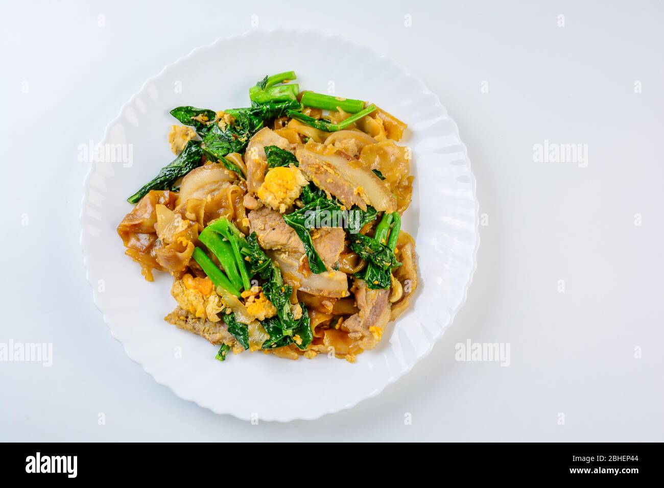 Stirfried Fresh Riceflour Noodles With Sliced Pork, Egg and Kale