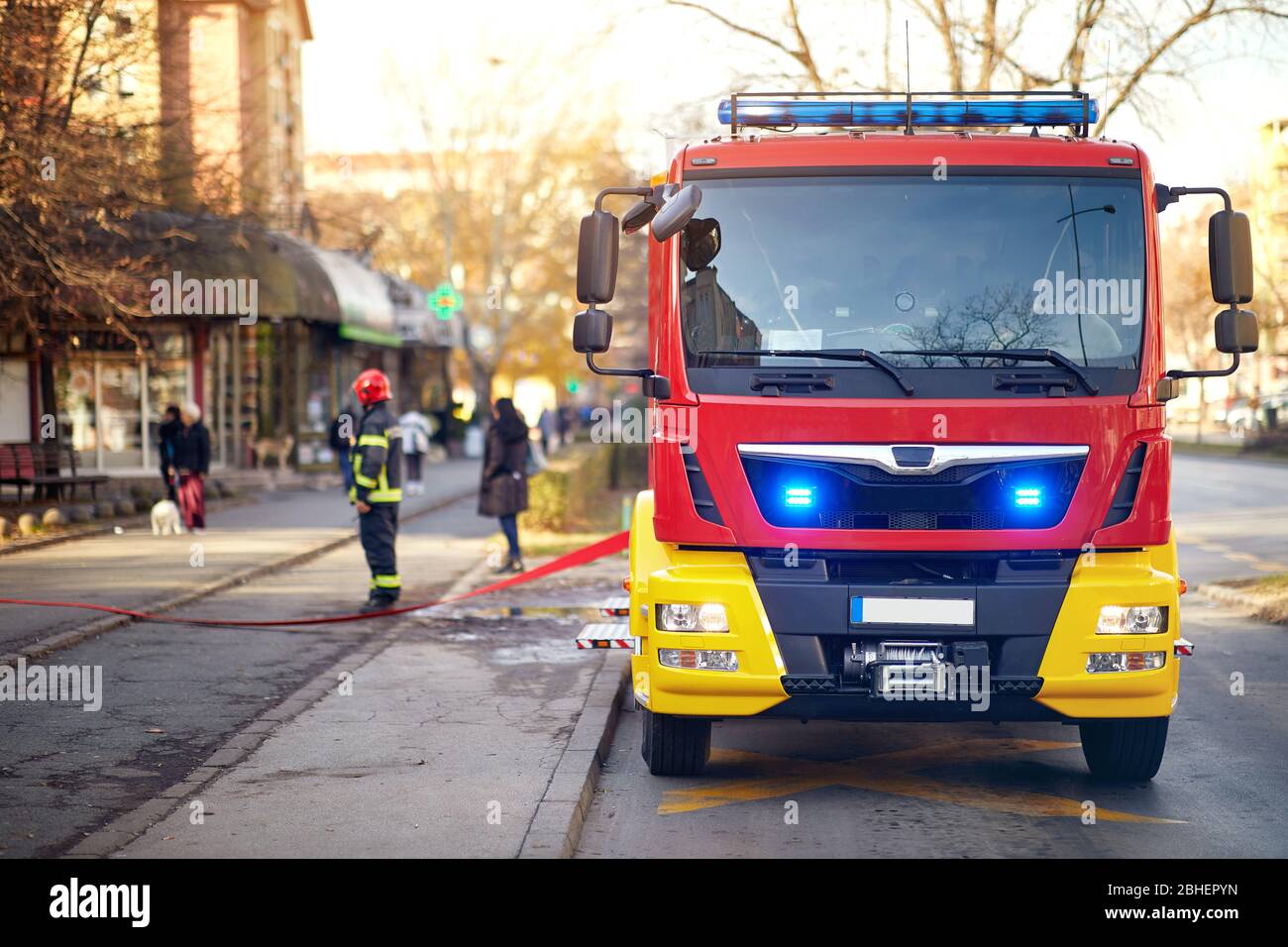 Fire truck. First Responders – firefighters.Fireman  in fire fighting operation. Stock Photo