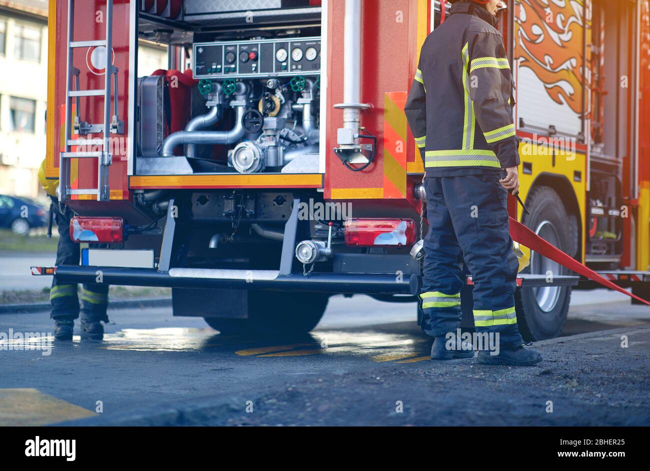 Firefighter pumper truck. Profesional Fire truck with fire fighting equipment. Stock Photo