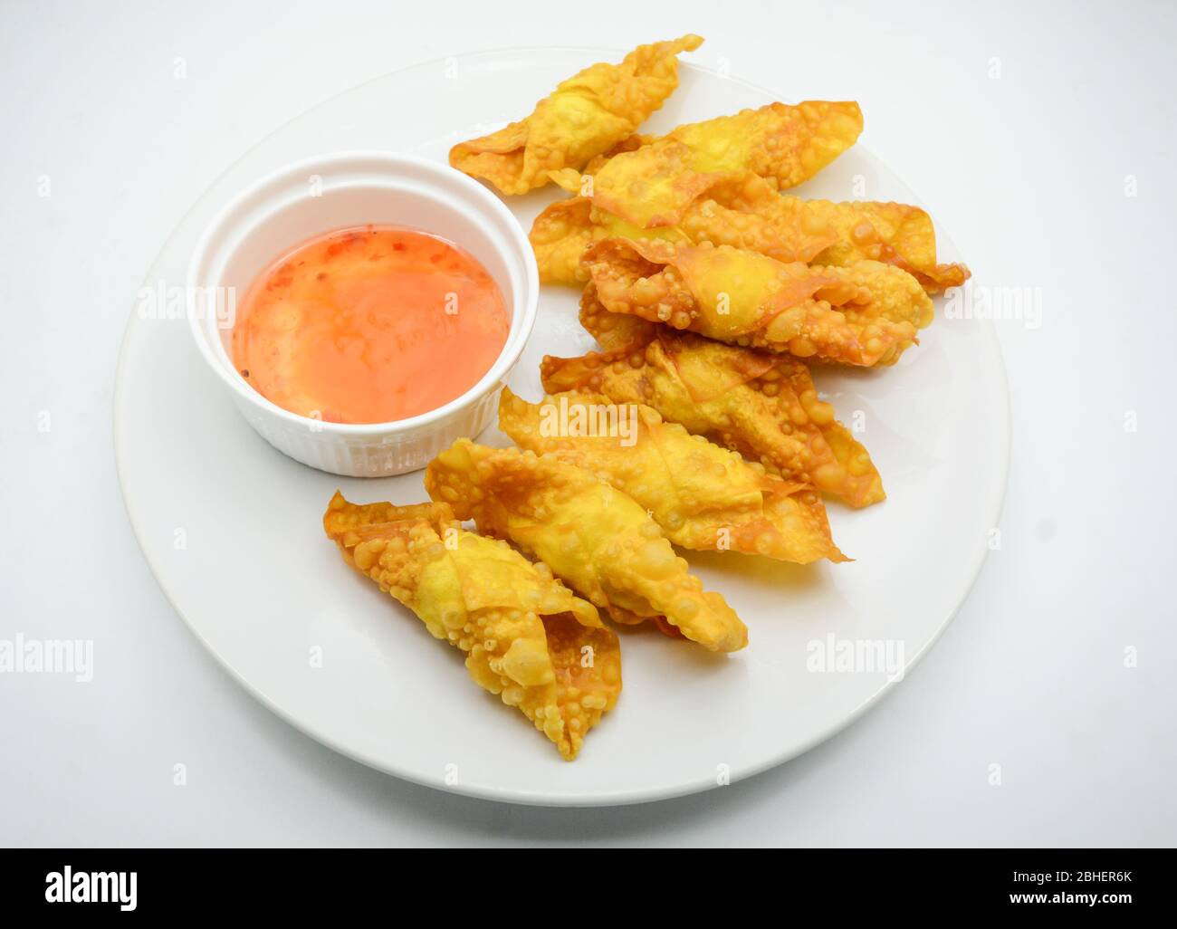 Deep Fried Won ton on white plate with dip source Stock Photo