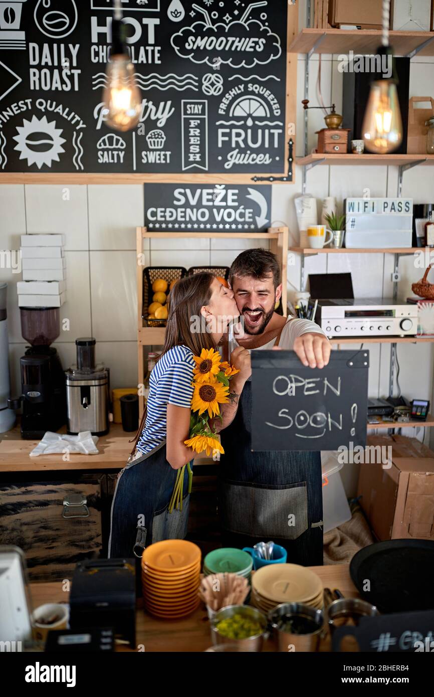 exited young couple having fun in their own cafe before opening. enthusiastic, excitement, joy, startup, business Stock Photo