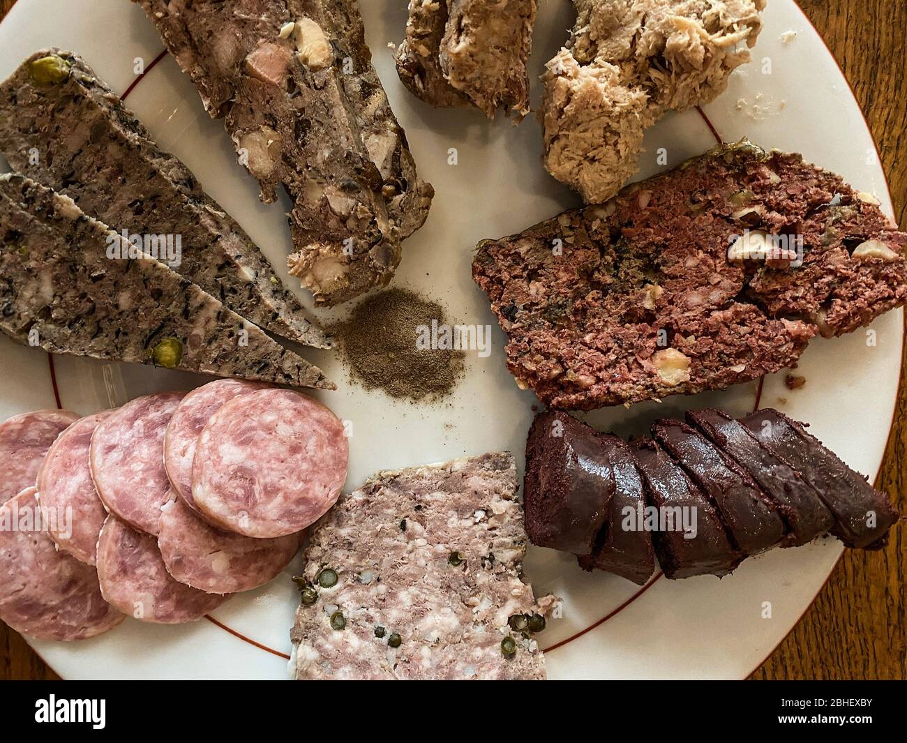 Top view on a french charcuterie assortment, sausage, rillettes, blood sausage Stock Photo