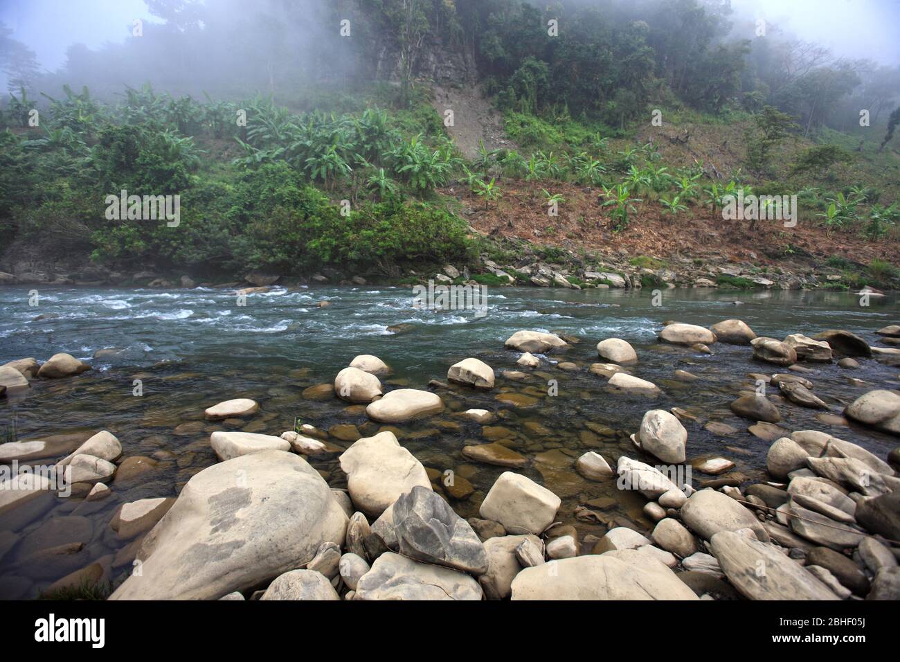 Stock Photo - Water flowing through the Sangu River, Bandarban, Bangladesh. Stock Photo