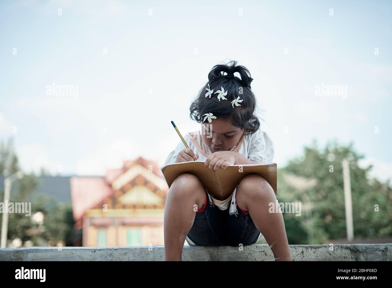 Asian little girl study from home during a virus  outbreak Stock Photo