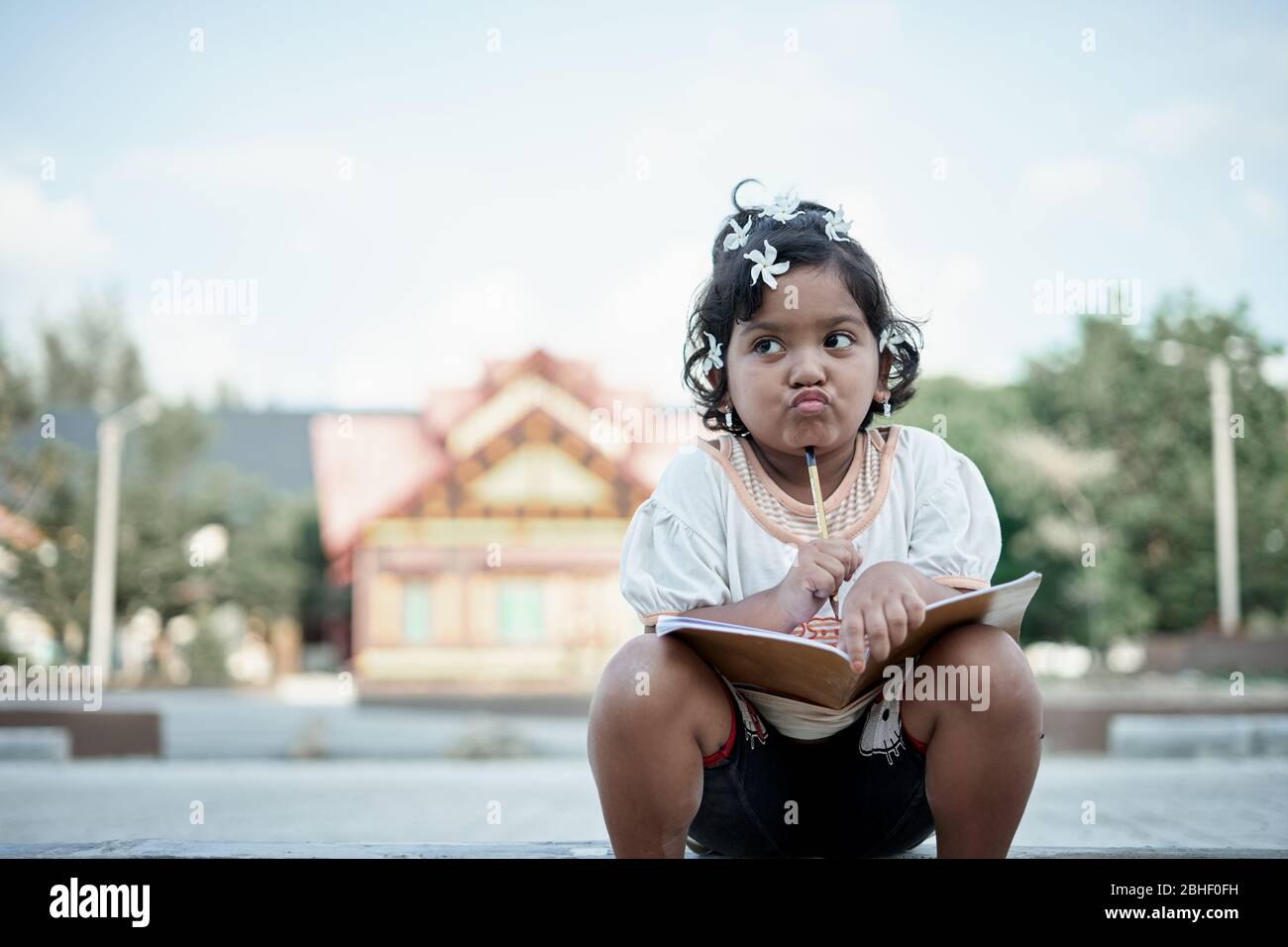 Asian little girl study from home during a virus  outbreak Stock Photo