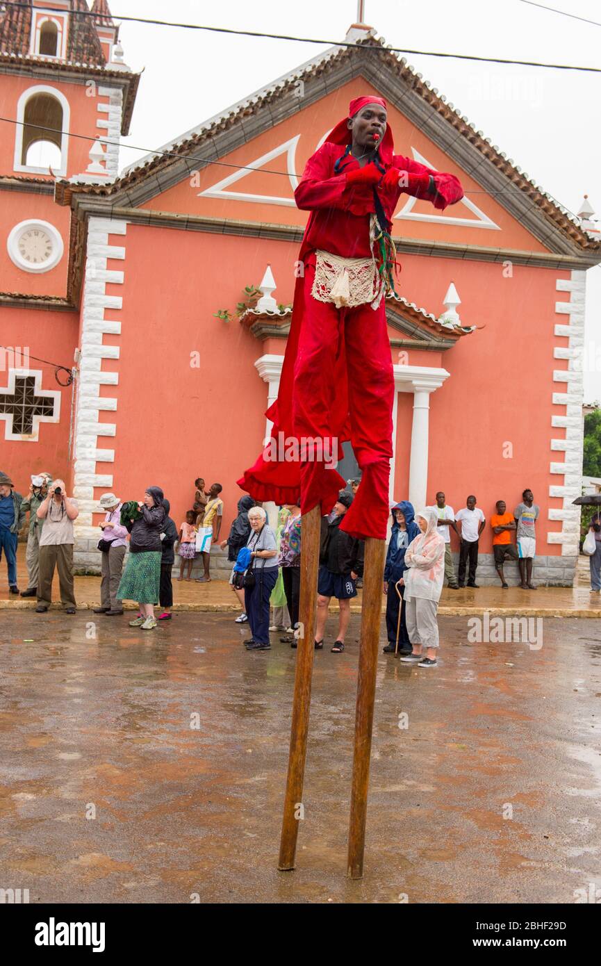 Conga dance performance with man on stilts at the fishing village of