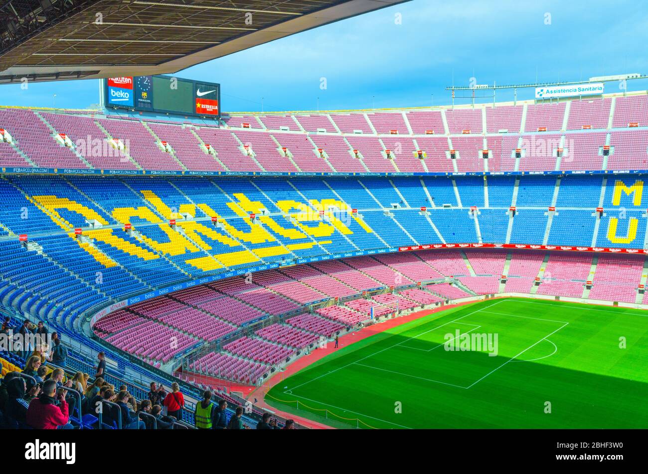 Barcelona, Spain, March 14, 2019: Camp Nou is the home stadium of football club Barcelona, the largest stadium in Spain. Top aerial view of tribunes stands, green grass field and scoreboard. Stock Photo