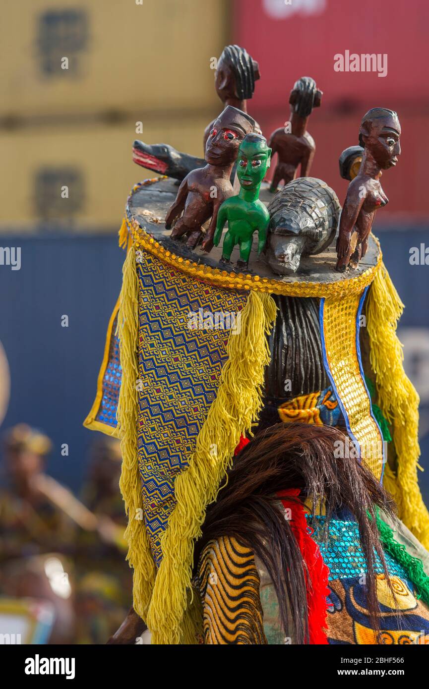 Cultural performance with mask dancers and musicians in the port of Lome, Togo. Stock Photo