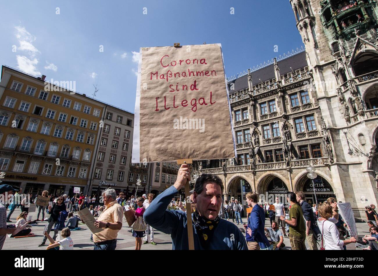 Munich, Bavaria, Germany. 25th Apr, 2020. ''Anti-Corona Measures are Illegal'' displayed during a QAnon-like demonstration in Munich, Germany. Organized in Telegram chats by conspiratorial "Querfront"" (cross-front) groups, the city of Munich, Germany saw numerous anti-state "Corona Parties"" as under mottos such as "Demonstration fuer die Erhaltung der Grundrechte"" (Demonstration for the Upholding of Basic Rights) and "Fuer unsere Freiheit, unsere Grundrechte und unsere Selbstbestimmung"" (Demonstration for our Freedom, Basic Rights, and Self-Determination). Numerous right-extr Stock Photo