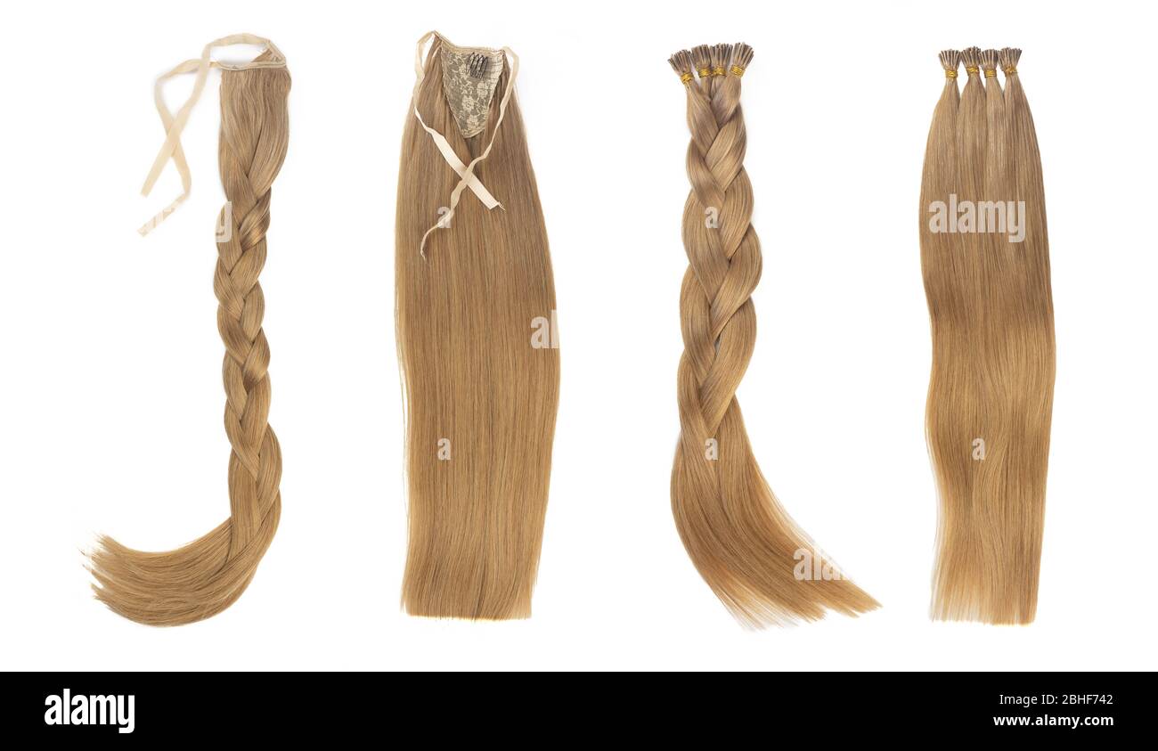 Set of multiple fake women hair extensions in tails, isolated on white background. Dark blonde or brown color. and different attachment types. Stock Photo