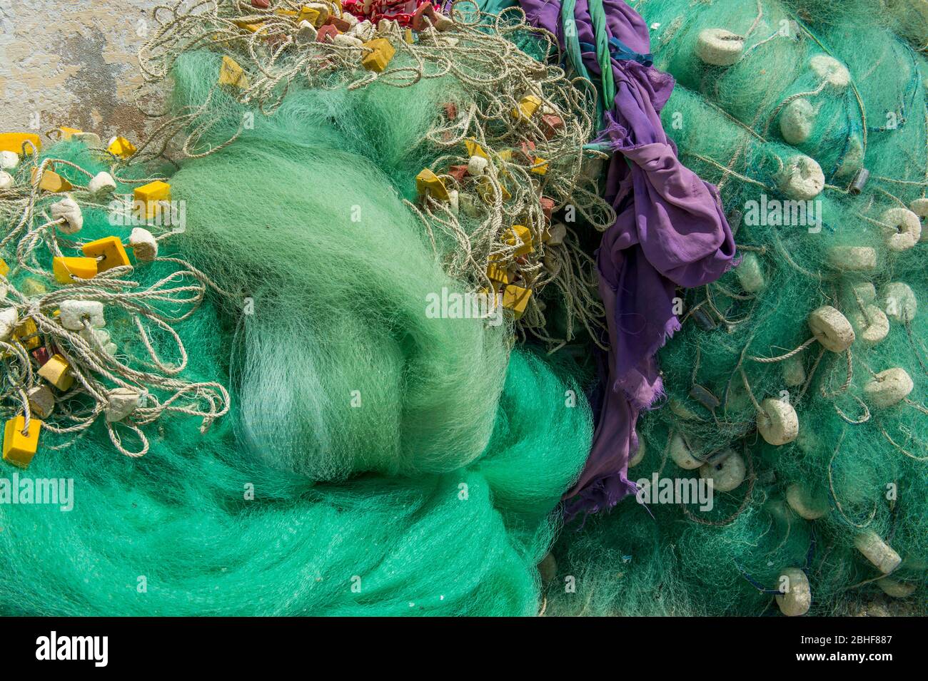 Colorful fishing nets on beach below Cape Coast Castle in Elmina, Ghana ...