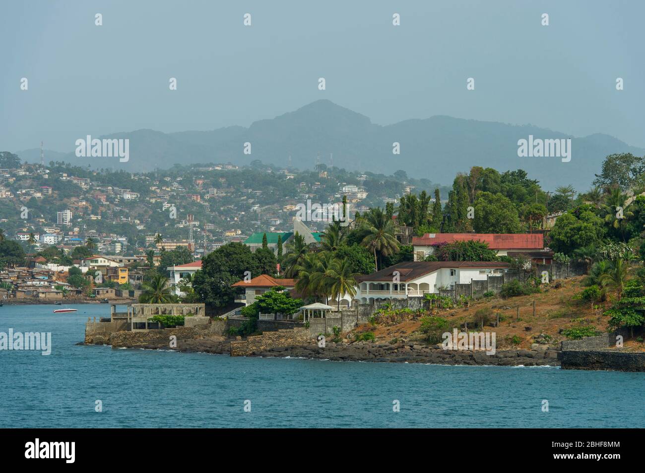 View from sea of the suburbs of Freetown, the capital city of Sierra Leone. Stock Photo