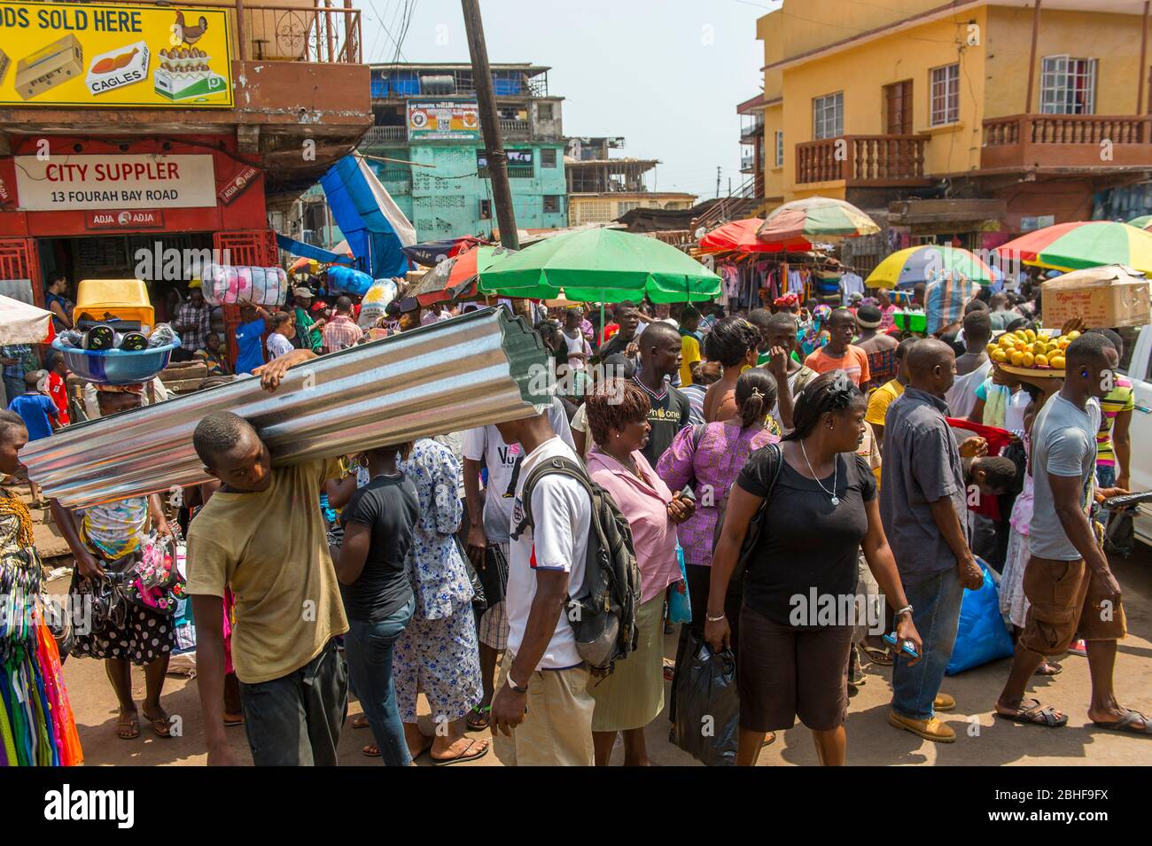 Busy street scene (Kissy Street) in Freetown, Sierra Leone. Stock Photo