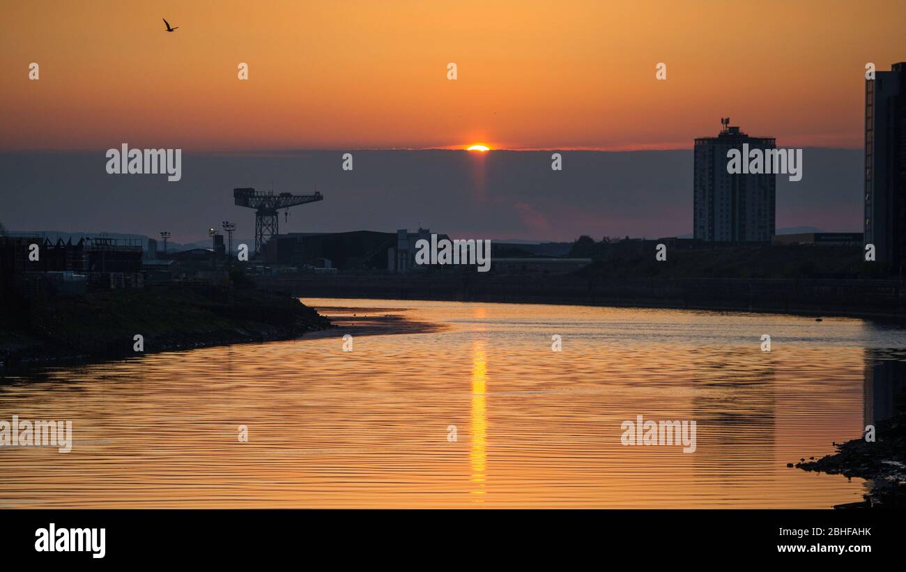 Glasgow, UK. 25th Apr, 2020. Pictured: Setting sun over the River Clyde, taken beside the Riverside Museum of Transport in Glasgow. Credit: Colin Fisher/Alamy Live News Stock Photo