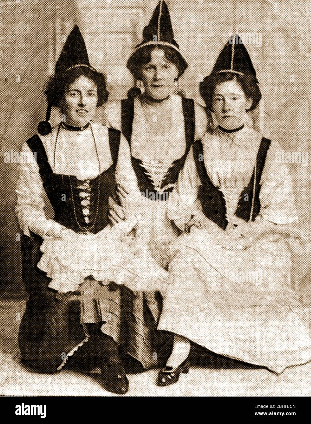 A rare photograph of three named Ranger Guides Circa 1900 , From Whitby, North Yorkshire, who had gained the  (original) Duke of Edinburgh's award for girls. -   Alfred Ernest Albert (1844 – 1900) reigned as Duke of Saxe-Coburg and Gotha from 1893 to 1900. He was the second son (fourth child) of Britain's Queen Victoria  and was named Duke of Edinburgh during  the Queen's Birthday Honours on 24 May 1866. Pictured (l to r) are  Miss Isabel Harker (never married), Gertie Pennock (later Mrs Edwin Todd) & Amy Smith (later Mrs G Heselton). The relevance of the costumes is unknown. Stock Photo