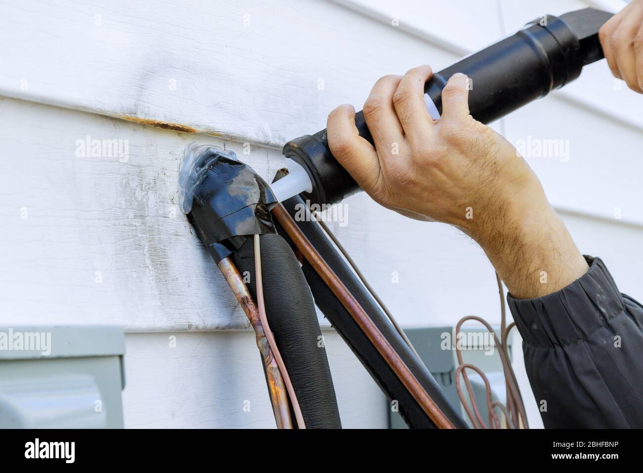 Sealing of silicone holes after installation of air conditioning pipes technological for a new