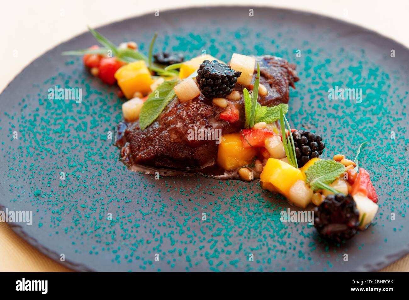 Slowcooked veal cheek with fruits and berries Stock Photo Alamy