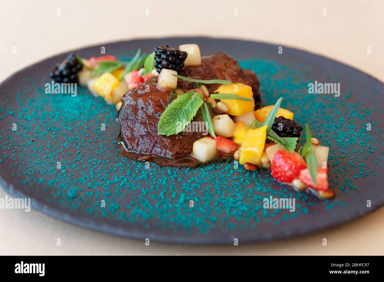 Slowcooked veal cheek with fruits and berries Stock Photo Alamy