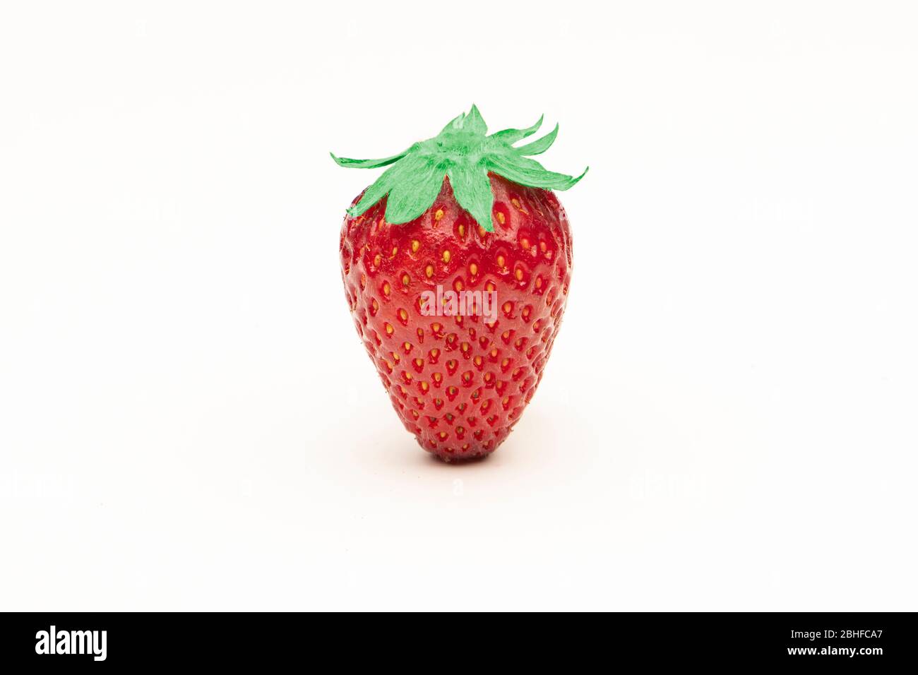 Strawberry close up isolated on a white surface Stock Photo - Alamy