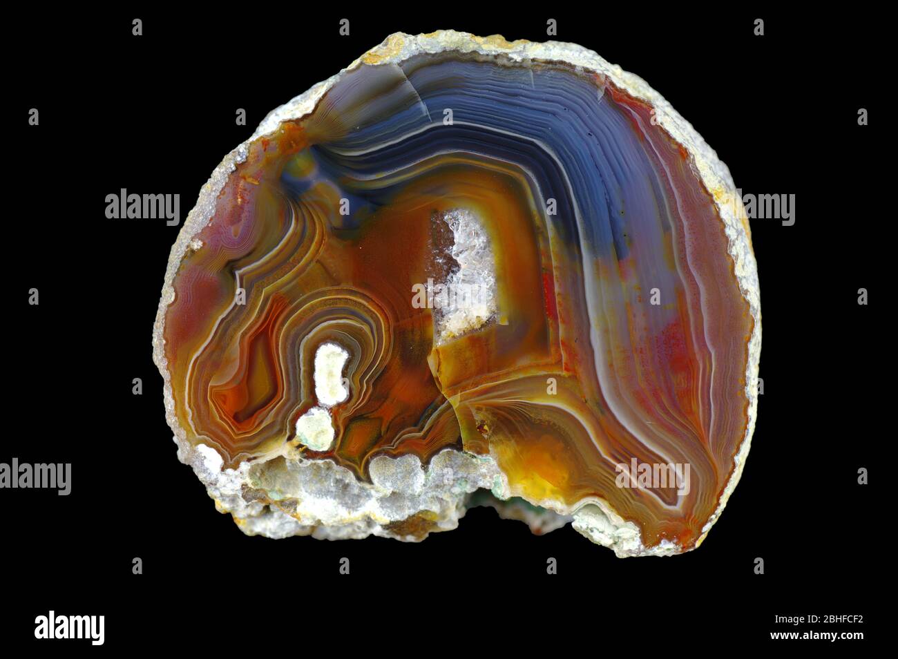 Fortress agate filled with quartz. Colorful ribbons colored with metal  oxides are visible. Origin: Rudno near Krakow, Poland Stock Photo - Alamy