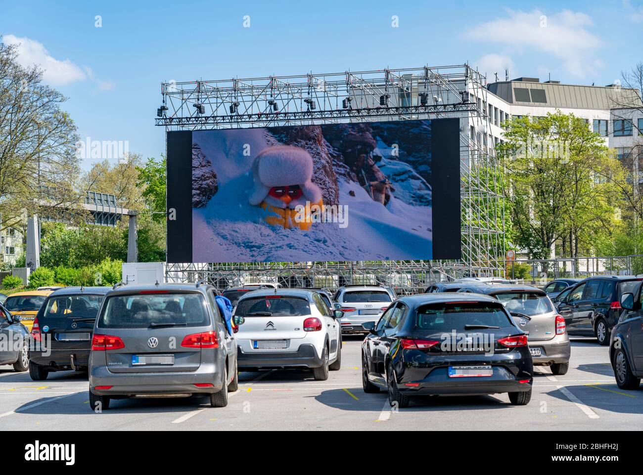 Temporary drive-in cinema, in the parking lot in front of Messe Essen, Grugahalle, large LED screen also allows film screenings in sunshine, family fi Stock Photo